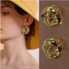 Boucles d'oreilles triangle torsadé or
