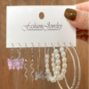 Ensemble de boucles d'oreilles papillon et perles