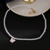 Collier papillon perlé